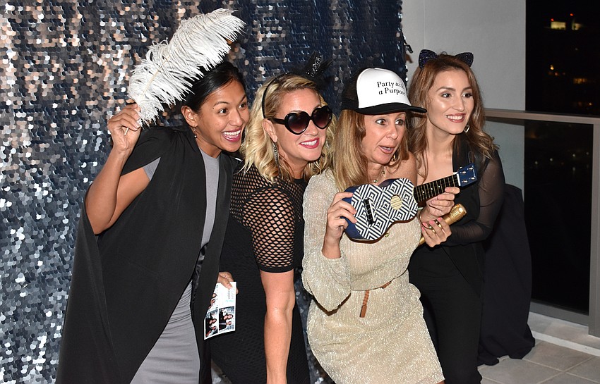 Sheena Palacios, Georgia Hudson, Michelle Nolan and Evelyn Saenz enjoy the phoot booth.