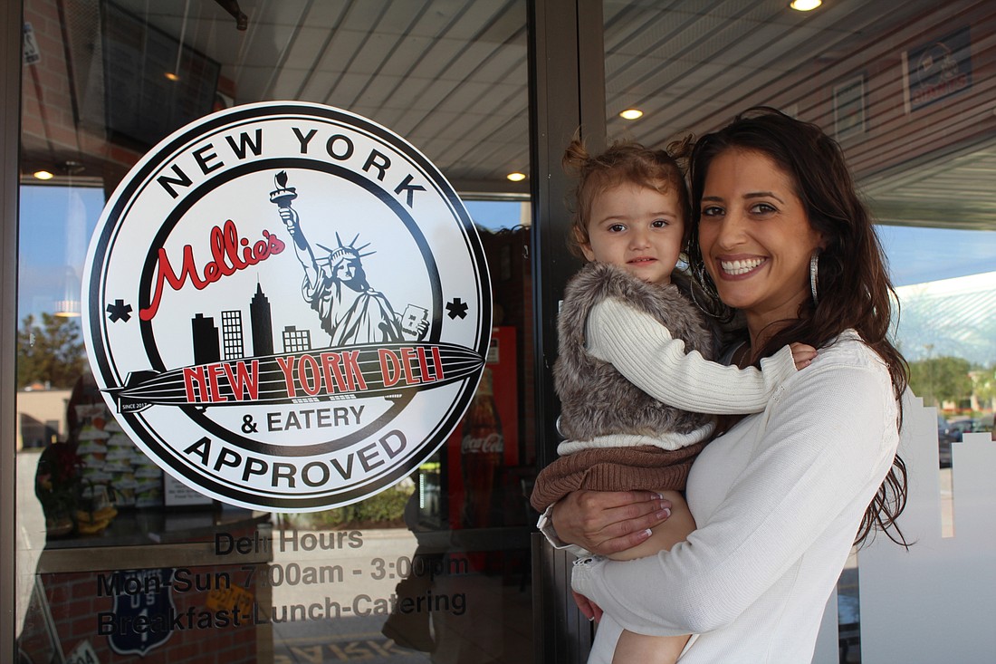 Mellie Fernandez, owner of Mellie&#39;s New York Deli & Eatery, brought a special guest to work, 1-year-old Gianna Fernandez, her youngest daughter.