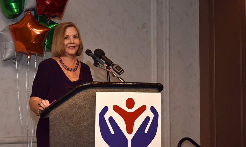 Children's Guardian Fund President Carol Belmont welcomes guests.