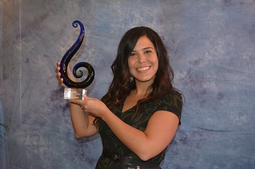 Amanda Arnold of Lakewood Ranch Golf & County Club shows off her Sandies award for Rising Star.