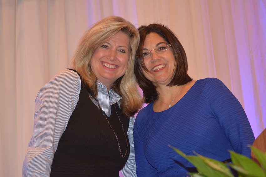 Heather Kasten, the Lakewood Ranch Business Alliance executive director, gets together with Lori Ruth, the Chair of the Board, before the presentations.