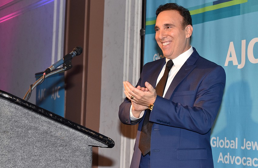 AJC Regional Director Brian Lipton claps for Award Winner Jennifer Rominiecki