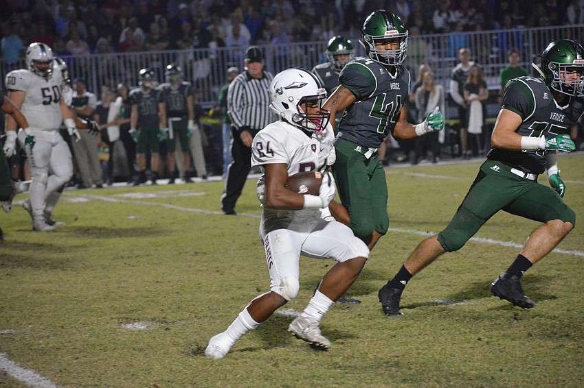 Pirates junior running back Camaron White cuts upfield against Venice.