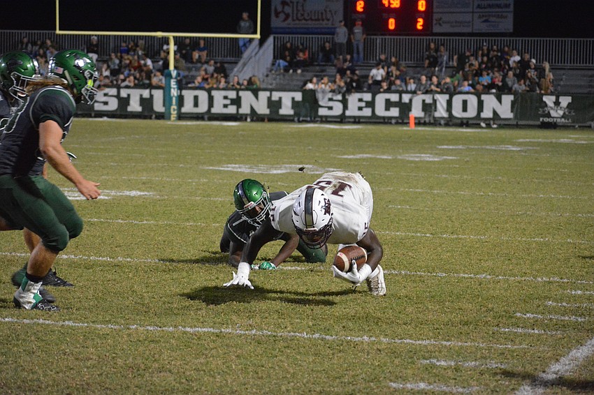 Pirates junior wideout Knowledge McDaniel dives for extra yardage. McDaniel finished with 13 catches and 216 yards.