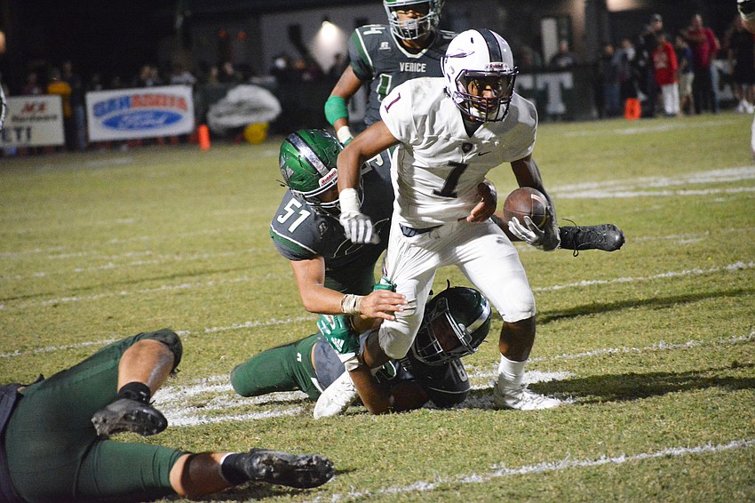 Braden River senior wideout Craivon Koonce gets dragged to the ground by a Venice defender after picking up a first down.