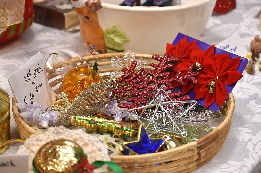 Pins and ornaments were on sale along with Christmas trees, wreaths, jewelry and baked goods.