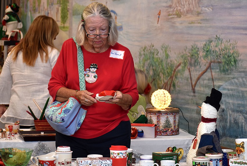 Sue Troup checks out items on sale during the Christmas Bazaar.