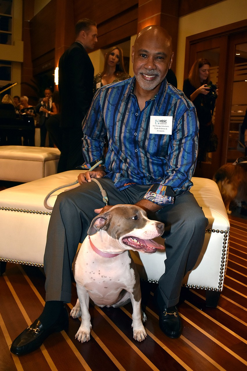 Pet therapy volunteer Clyde Andrews with Bella