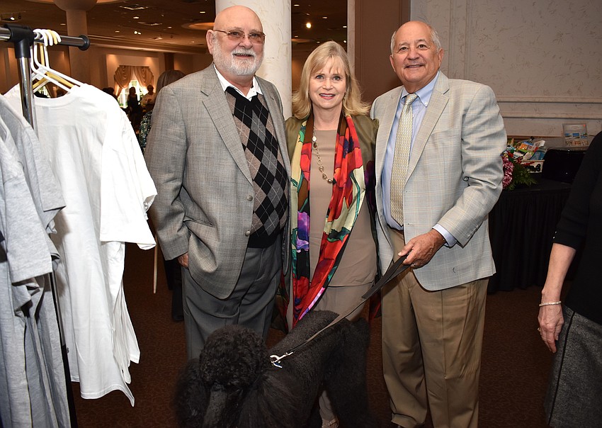 Fred Stansberry, Frank and Tricia Robles, founder of Florida Poodle Rescue, and Simon the poodle