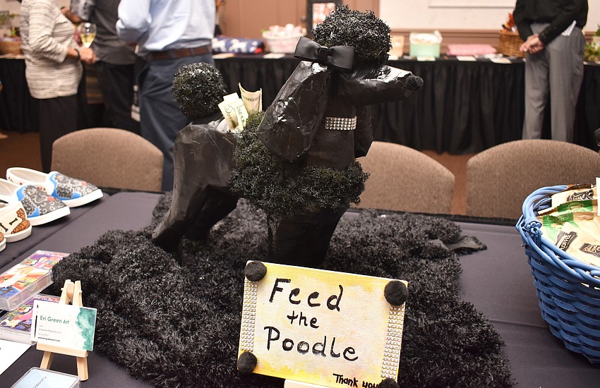 One silent auction item was a handcrafted poodle statue that doubled as a way to raise money for Florida Poodle Rescue.