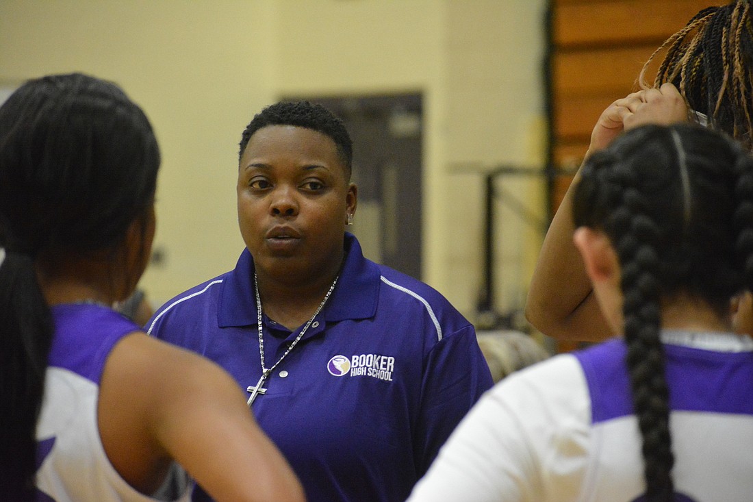 Shantia Grace, Riverview High&#39;s all-time leading scorer, is now Booker High&#39;s girls basketball coach. Here, she pumps up her team during a stoppage against Palmetto High.