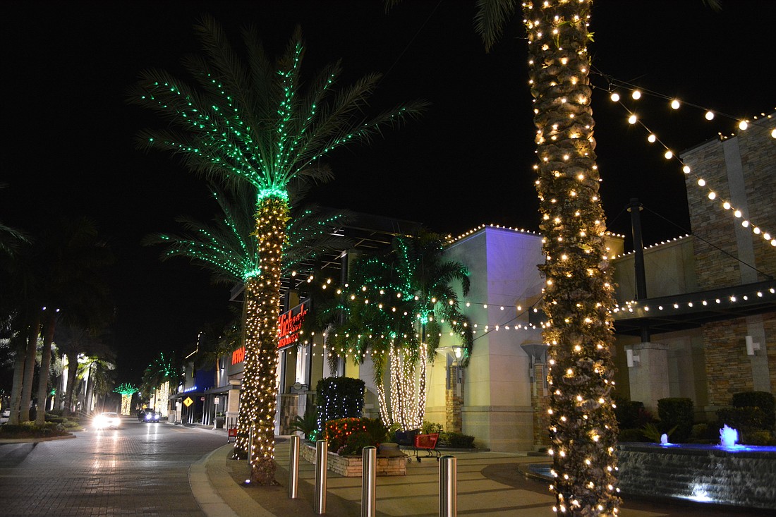 Benderson Development has decorated its shopping plazas in the University Parkway corridor with millions of Christmas lights.
