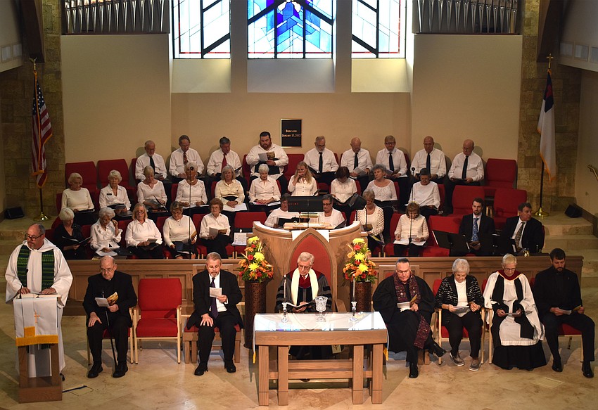 An interfaith choir with members from different congregations and the clergy members lead the service.