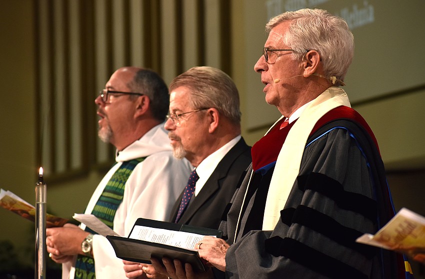 The Rev. Kenneth Blyth, Rabbi Stephen Sniderman and the Rev. Norm Pritchard sing the benediction song.