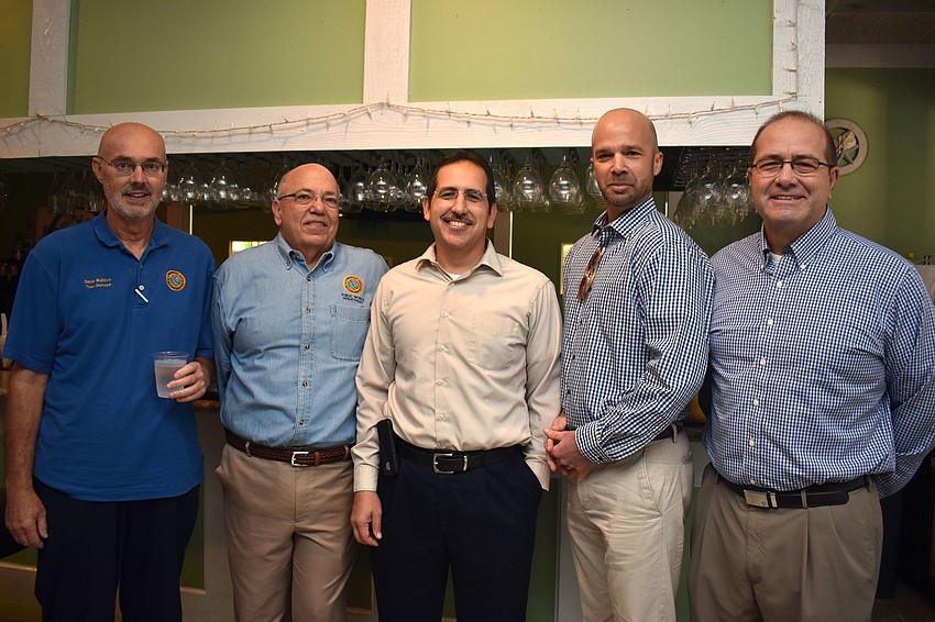 Retiring Town Manager Dave Bullock, retiring Public Works Director Juan Florensa, new Public Works Director Isaac Brownman, Planning, Zoning and Building Director Allen Parsons and incoming Town Manager Tom Harmer