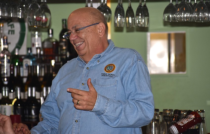 Outgoing Public Works Director Juan Florensa laughs as he addresses the crowd.