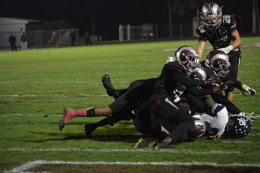 The Rams stop a Panthers running back at the goal line.