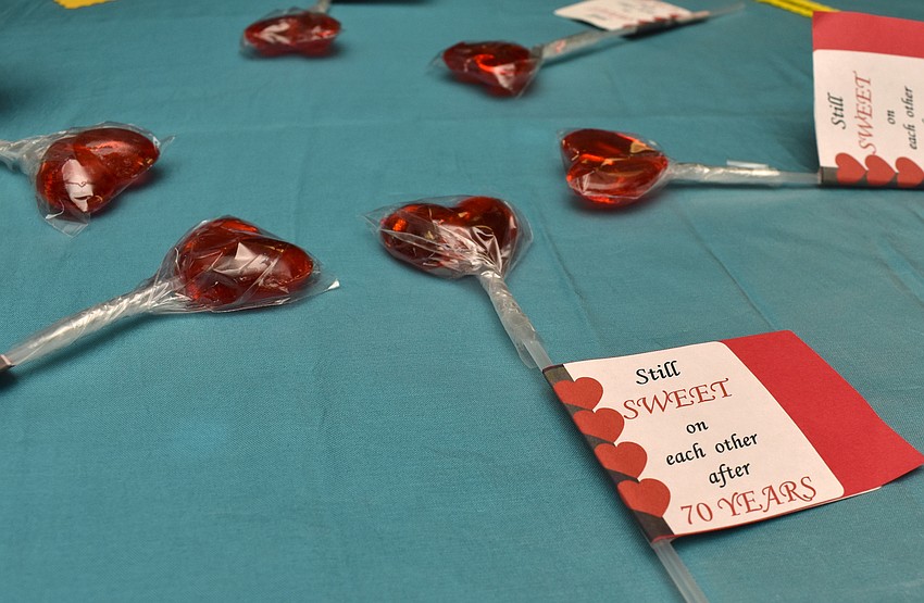 The couples’ children and grandchildren decorated the tables with heart suckers adorned with photos of the couple and sweet messages.