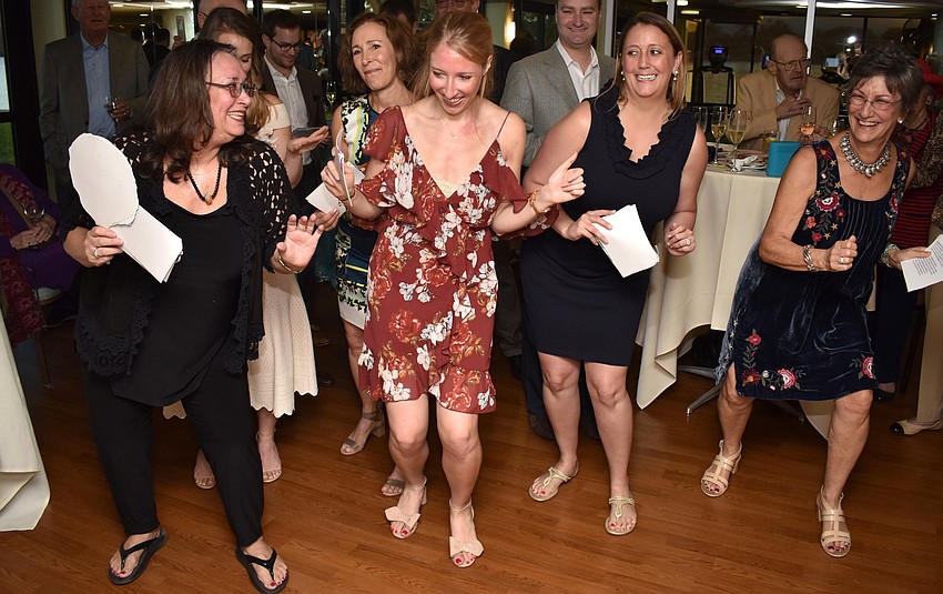 Kim Schaffer, Carly Bristol, Meg Callahan, Chelsea Callahan, Maggie Schaffer and Jan Kliger perform a “medley” of songs they created new lyrics for about their parents’/grandparents’ love.