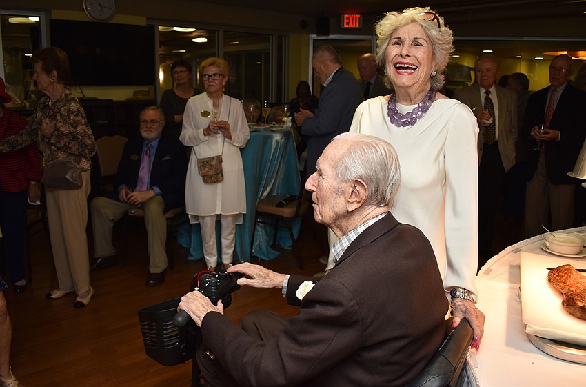Mort and Carol Siegler react as they watch their kids and grandkids perform a medley for them.