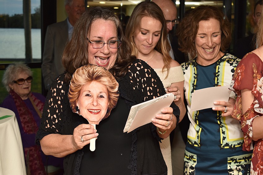 Kim Schaffer laughs as she performs a medley for her parents.