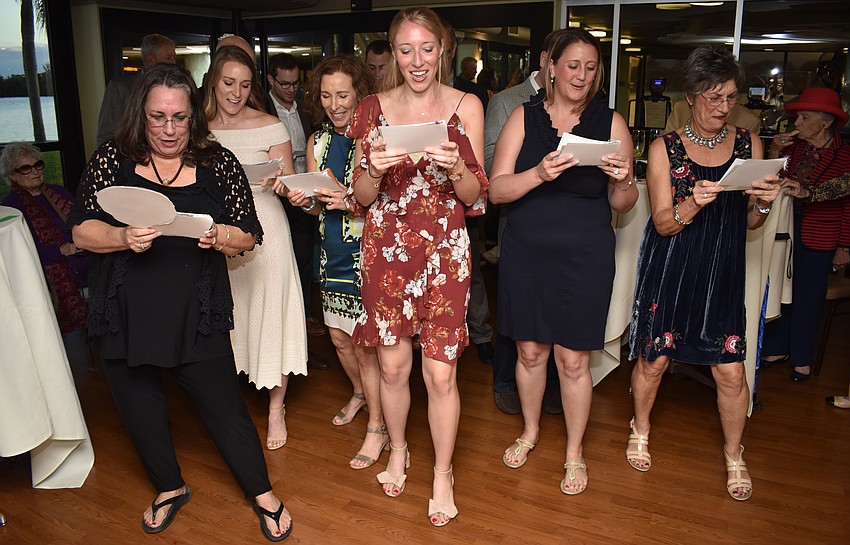 Kim Schaffer, Carly Bristol, Meg Callahan, Chelsea Callahan, Maggie Schaffer and Jan Kliger perform a “medley” of songs they created new lyrics for about their parents’/grandparents’ love.