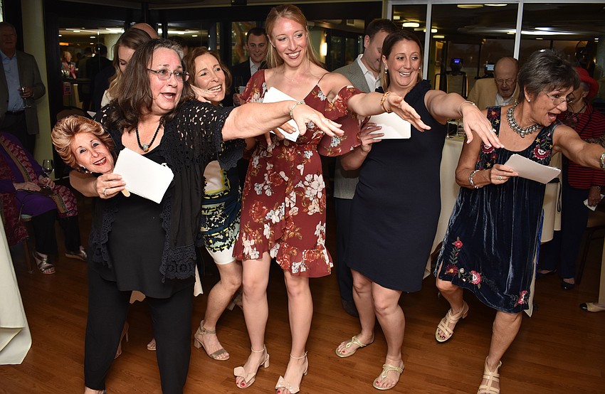 Kim Schaffer, Carly Bristol, Meg Callahan, Chelsea Callahan, Maggie Schaffer and Jan Kliger perform a “medley” of songs they created new lyrics for about their parents’/grandparents’ love.