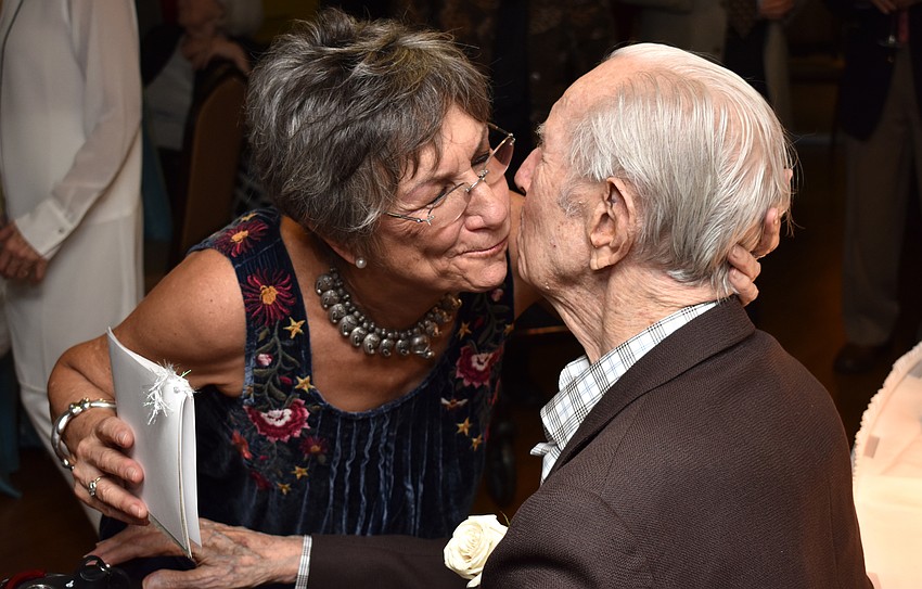 Jan Kliger gives her father, Mort Siegler, a kiss after her medley performance.