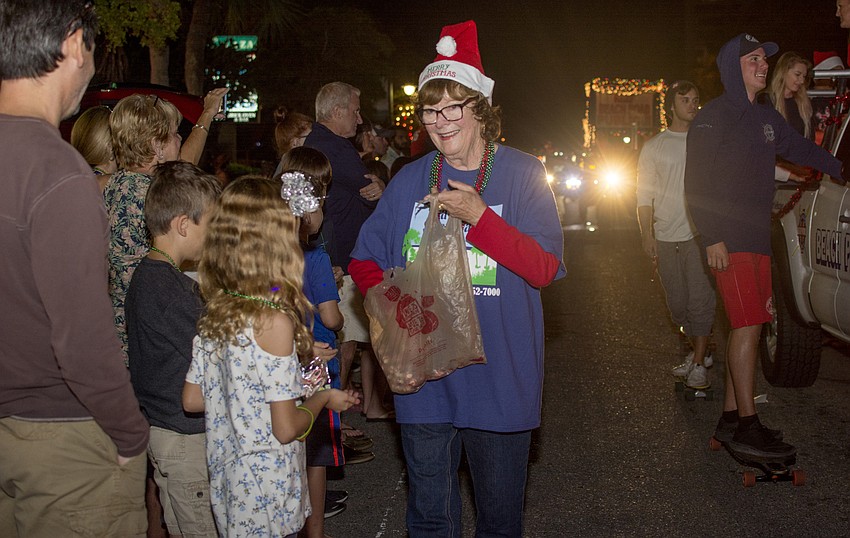 Gail Jurentka passes out candy in the Siesta Key holiday parade.