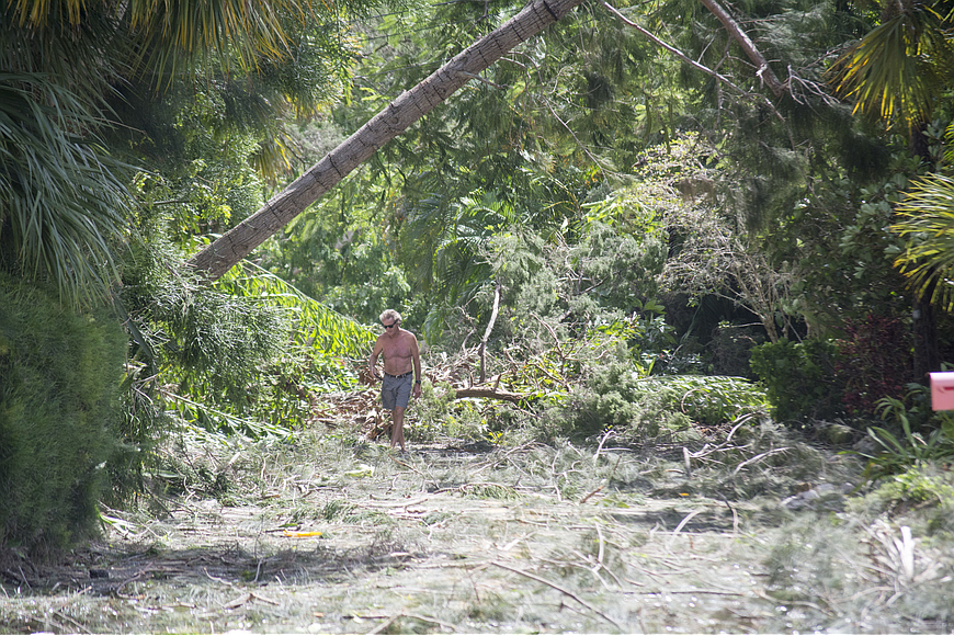 Peter Hull surveys the damage on Ogden Street on north Siesta Key.