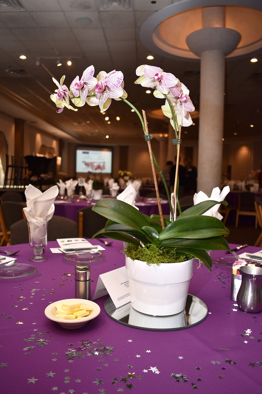 Every table was adorned with an orchid centerpiece.