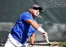 Alexander Pier serves during the Senior Clay Courts Super Category II Tournament.
