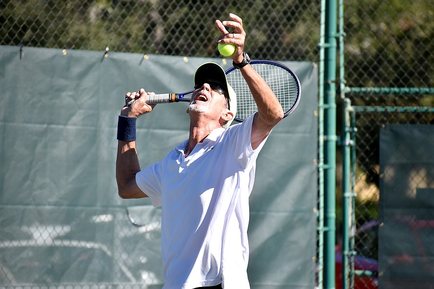 Larry Turville serves during the Senior Clay Courts Super Category II Tournament.