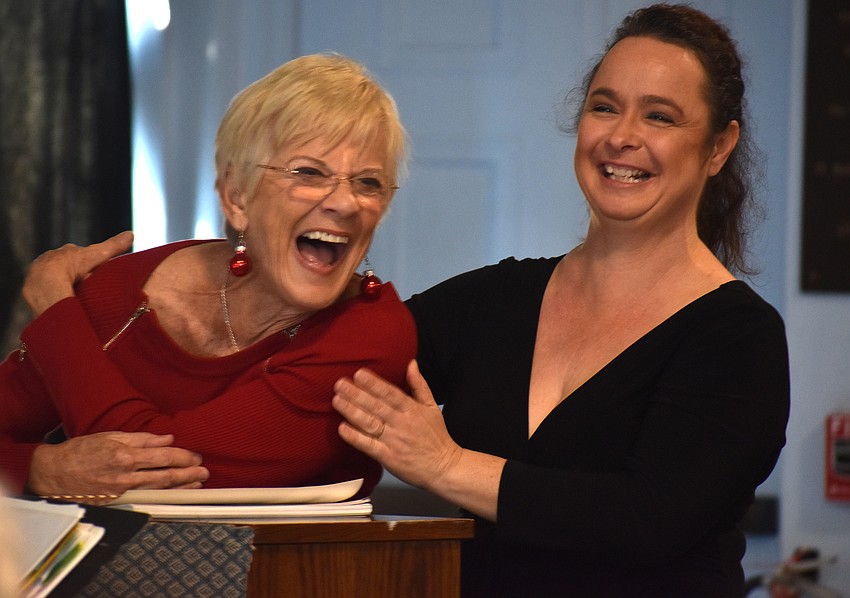 Lee Dougherty Ross, artistic director of Artist Series Concerts of Sarasota, and opera singer Michelle Giglio laugh with the crowd.