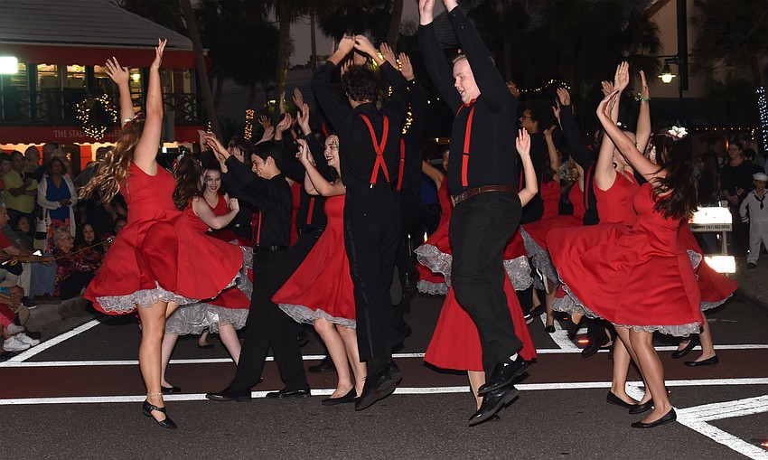 The Sarasota High School Drama Department dance troupe performs for the crowd.