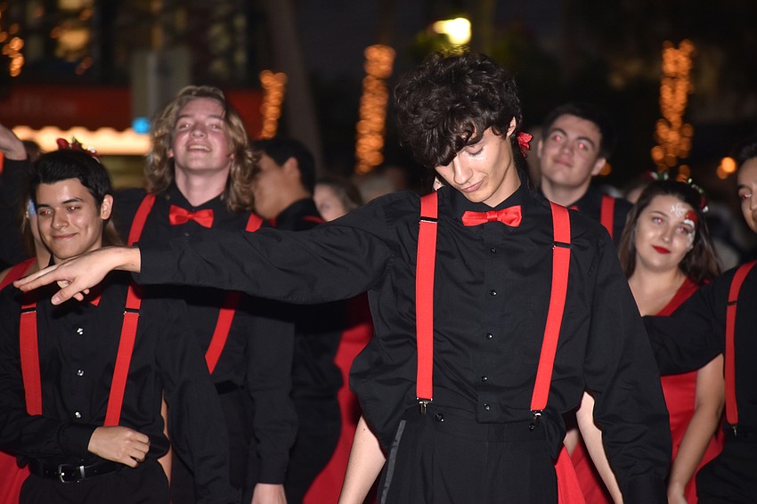 The Sarasota High School Drama Department dance troupe performs for the crowd.