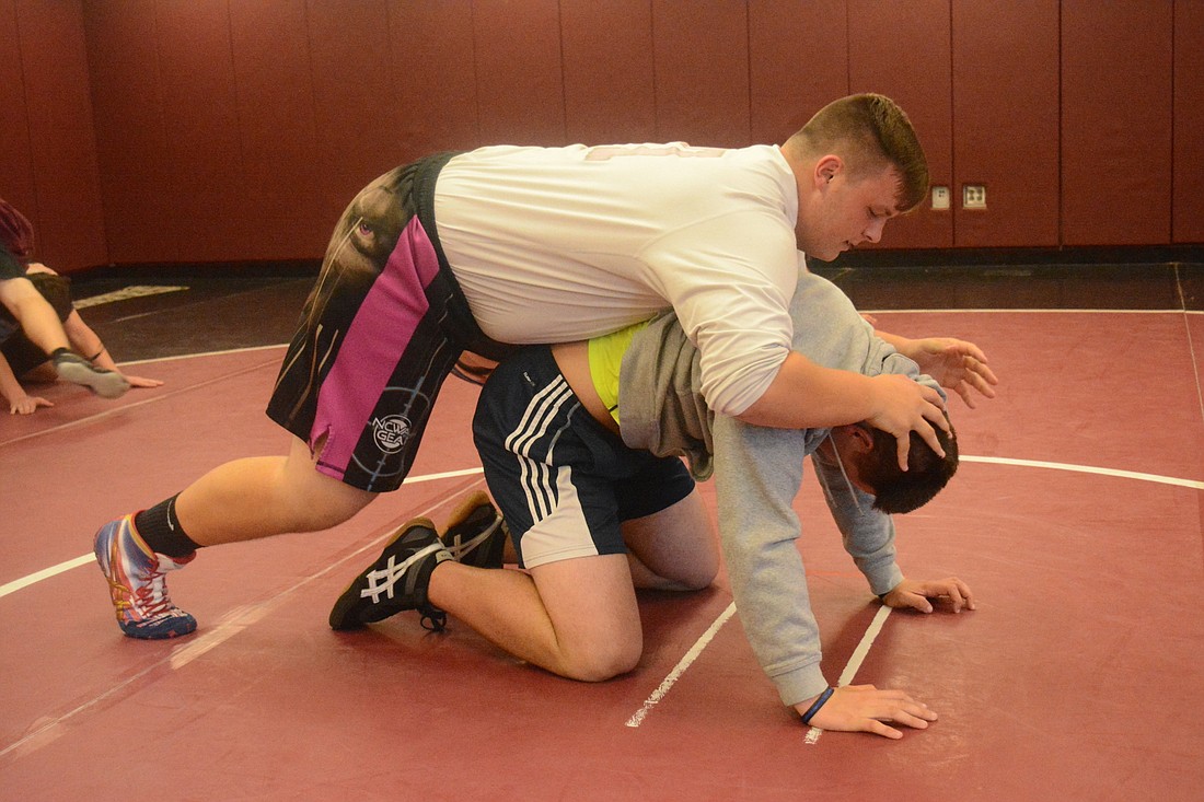 Brendan Bengtsson spins around wrestling partner Chase Knopf. Bengtsson is attempting to get wrestling-ready now that football is finished.