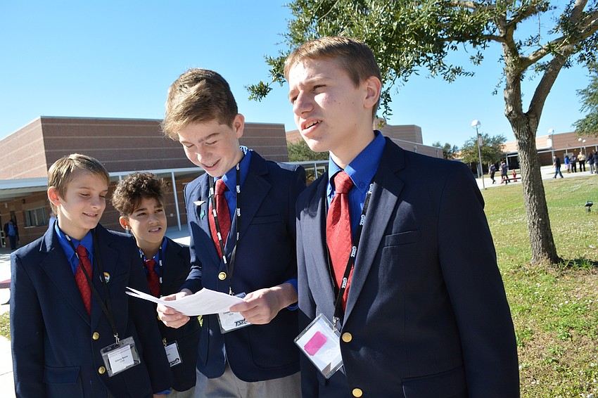 Haile Middle School's Sidney Buice, Mark Parsons and Cooper Buttari quiz their teammate Liam Tvenstrup in preparation for the chapter team competition, which tests knowledge of parliamentary procedure.