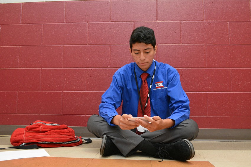 Braden River High's Nick Caballero  has 15 minutes to create a speech on  radio frequency identification, a topic he just received, as part of the extemporaneous speech contest.