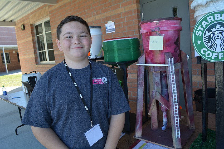 Braden River Middle School's Christian Bell waits for his water tower to be tested. He made it with teammates Connor Hoffman and Ryan McConnaghy, not pictured.