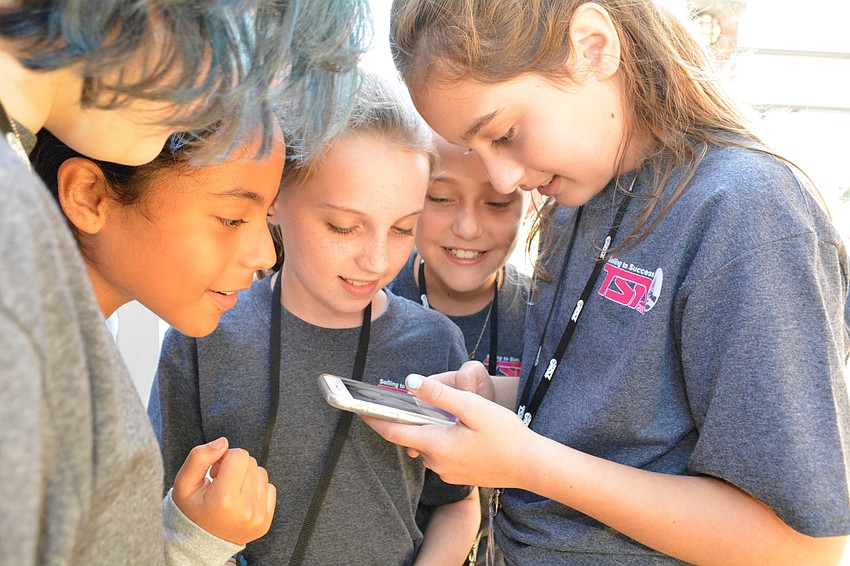 Marissa Braden, Isabella Abreu, Brooke Palmtag, Kylie Caffrey and Audrey Bachman squish together for a selfie during lunch break.