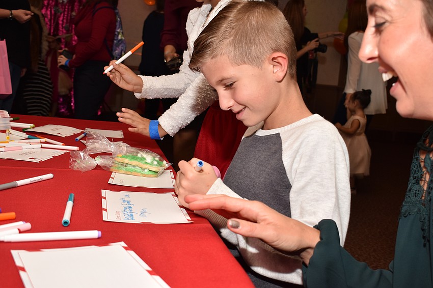 Braylon and Lindsay Westrick write letters to Santa.
