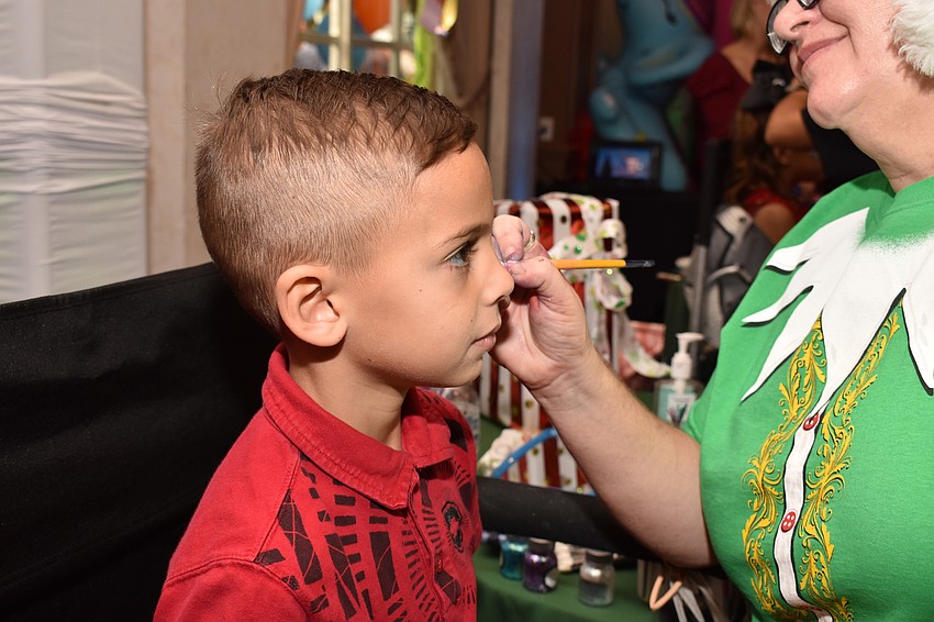 Asher Wasserman gets his face painted.