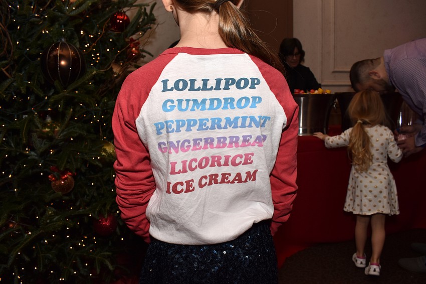 Hadley Lawrence shows off her shirt, which perfectly fit the theme of Christmas in Candyland.