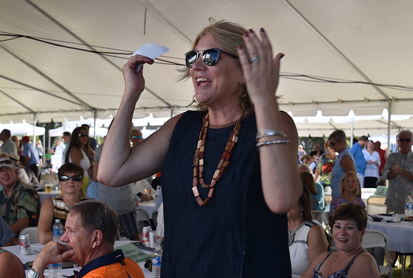 Jill Raleigh reacts to winning the $20,000 cash prize.