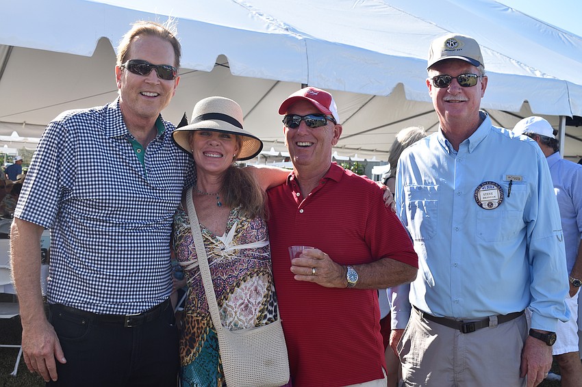 Congressman Vern Buchanan, winner of the Universal Studios VIP package Linda Chambers, Doug Withers and Kiwanis Club President Steve Branham