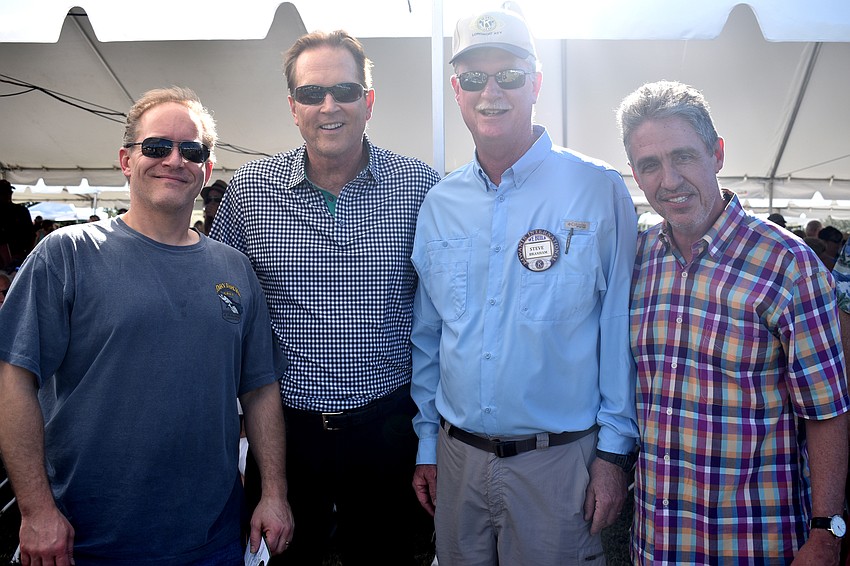 The Lazy Lobster dinner winner Chris Polit with Congressman Vern Buchanan and Kiwanis Club President Steve Branham and Michael Garey, owner of The Lazy Lobster