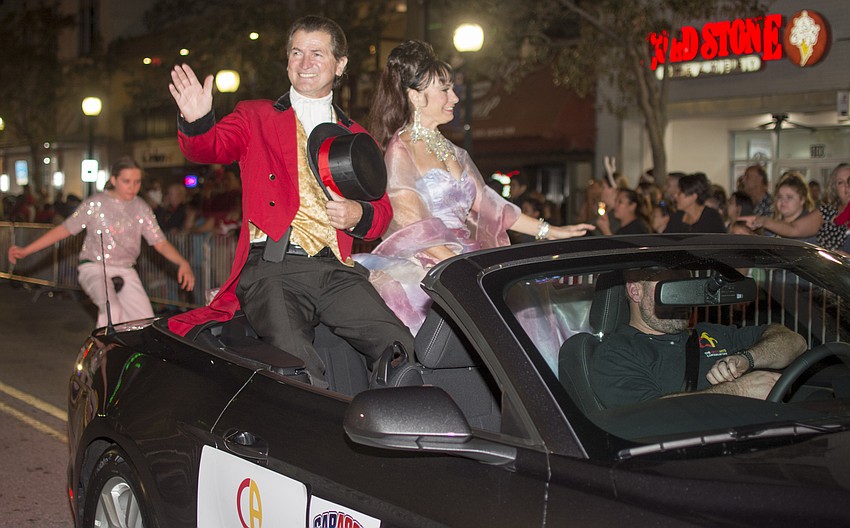 Circus Arts Conservatory Co-founders Pedro Reis and Dolly Jacobs ride in the downtown Sarasota holiday parade.