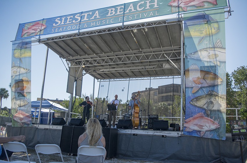 Hard Luck Society performs during the annual Siesta Beach Seafood and Music Festival.