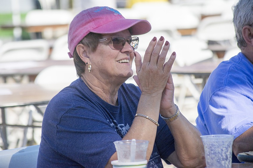 Christine Garrett enjoys the Hard Luck Society during the annual Siesta Beach Seafood and Music Festival.